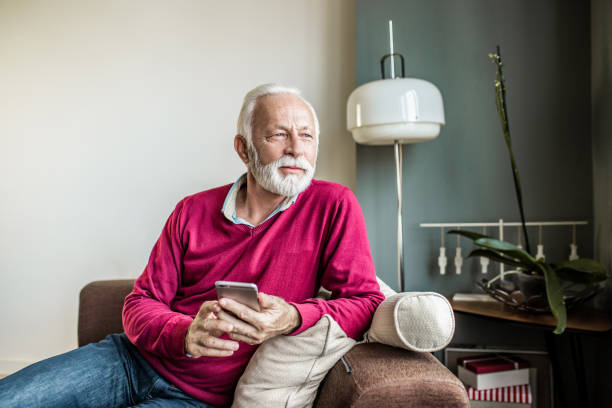 istock Senior men is at home using smart phone 1250729604