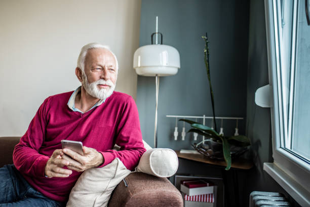 istock Senior men is at home using smart phone 1250729659