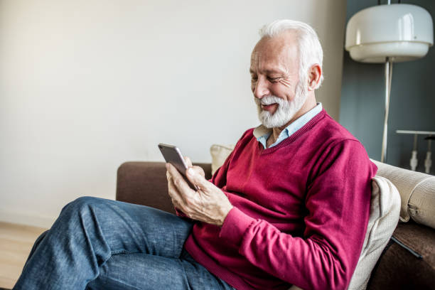 istock Senior men is at home using smart phone 1250729675