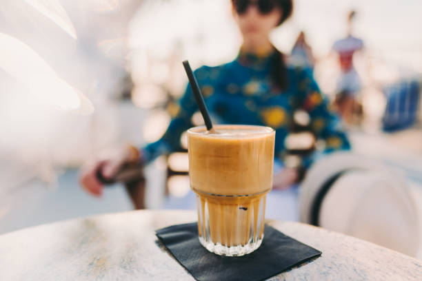 summer, vacation and iced coffee frappe at the beach - espresso women cup drink imagens e fotografias de stock