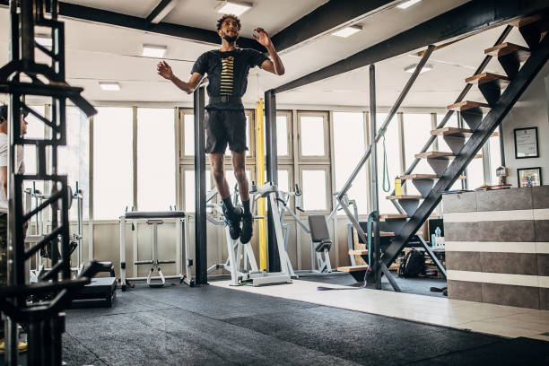 istock Young man volleyball player training in the gym 1250730262