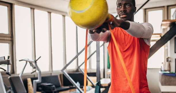 istock One young man volleyball player training with kettlebell in the gym 1250731510