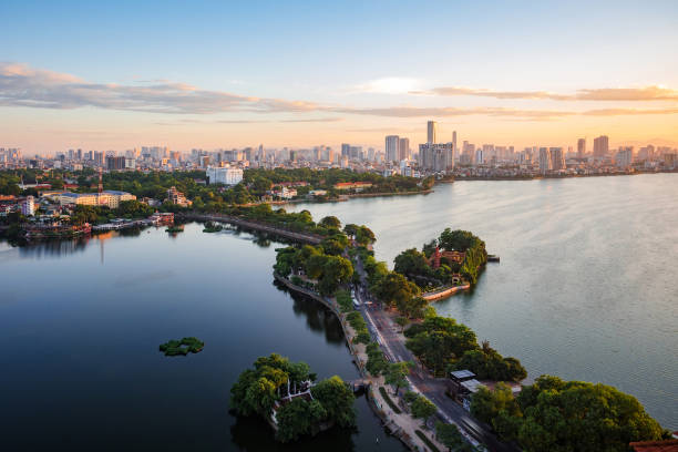 Hanoi, Vietnam, Aerial View of West Lake and Tay Ho District at Sunset Aerial view of Hanoi skyline showing West Lake and Tay Ho District at sunset in Hanoi, Vietnam. west lake stock pictures, royalty-free photos & images