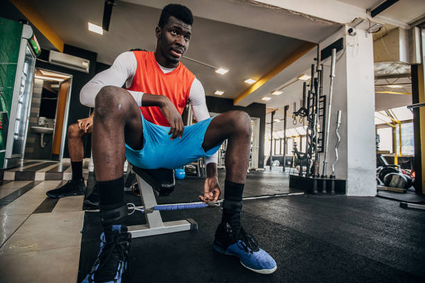 istock Man volleyball player resting in the gym 1250735042