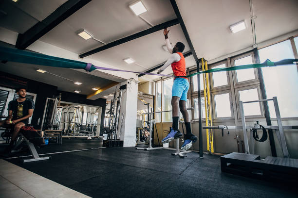 istock Man volleyball player having pre-season training in the gym 1250735697