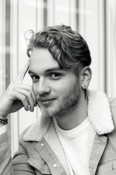 istock Portrait of young man, black and white, background with copy space 1250735799