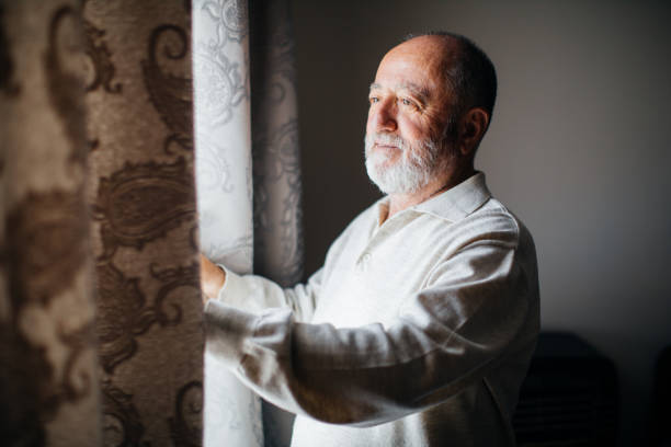 istock Happy senior men opens the curtains 1250736002