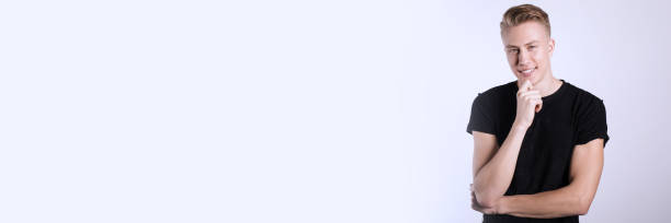 istock Sexy smiling male model against white background 1250736012