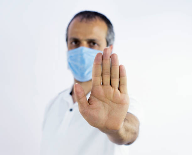 istock 30-40 years old man wearing surgical mask, covid-19 concept 1250739965