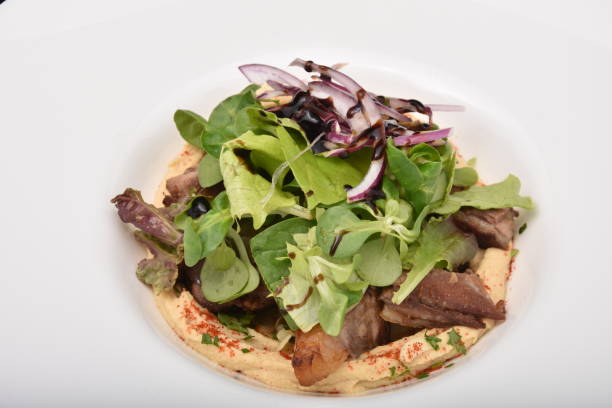istock duck meat in sauce with organic salad 1250741902
