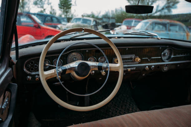 istock Retro car Interior. Steering wheel of abandoned rusty old car 1250746841