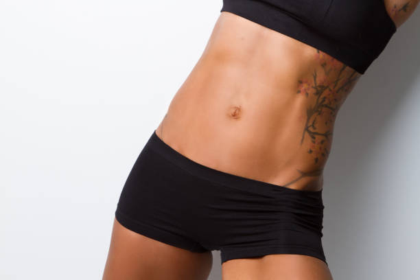 istock Strong flat abs on very fit female 1250775388
