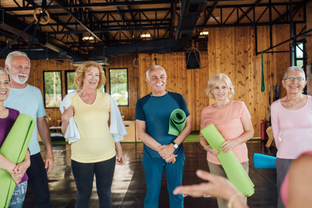 istock Seniors beginning with group yoga 1250775931