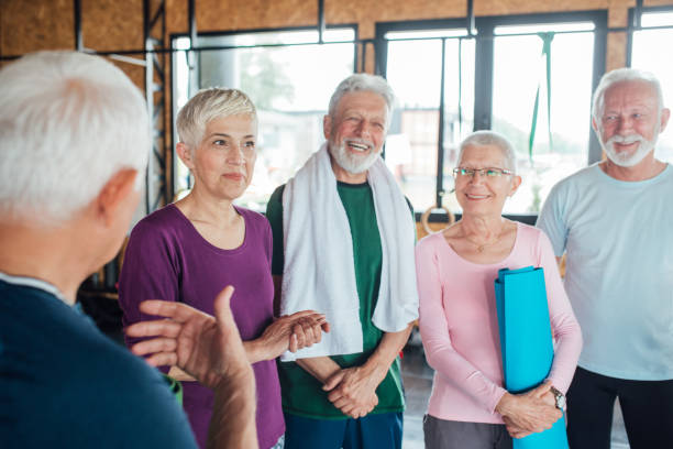 istock Group of seniors talking and relaxing before their yoga class 1250775942