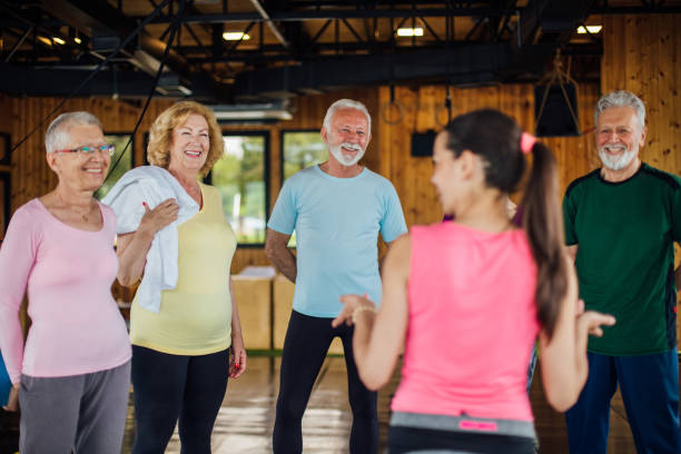 istock Young instructor starting a yoga practice with a group of seniors 1250775949