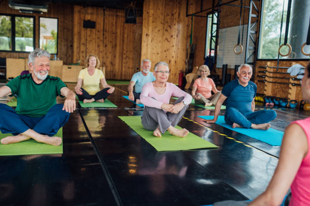 istock Happy seniors enjoying on yoga class 1250776457