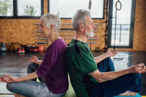 istock Yoga in pairs for seniors 1250776472