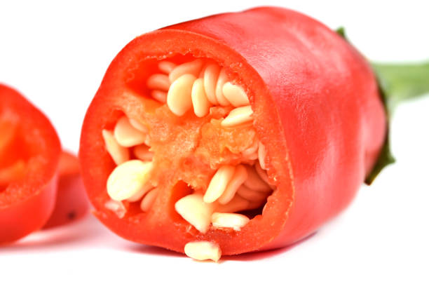 istock Half pieced chilli pepper with seeds isolated on white background. 1250778195