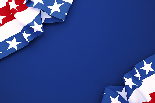 Flags textured with stars and stripes on navy blue background. Horizontal composition with copy space. Directly above.