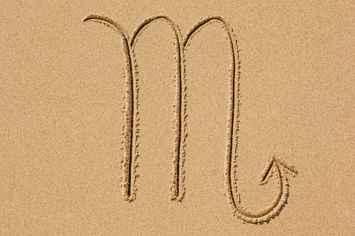 western astrological sign drawing in the sand, the scorpion, scorpio, october 23 to november 21