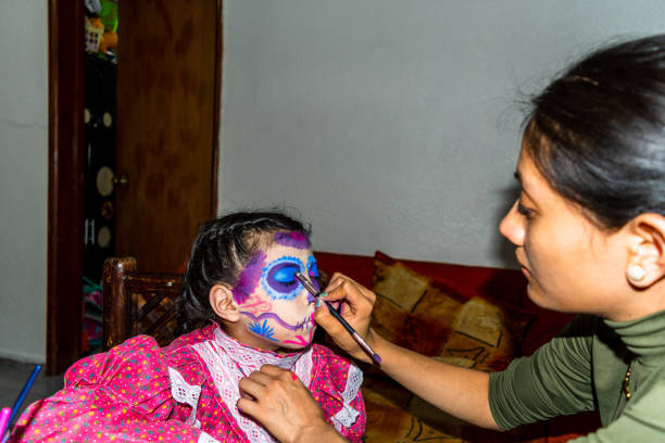 istock woman putting makeup on girl 1250794303