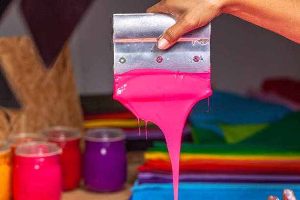 istock pink color dripping from hand screen printing 1250795370