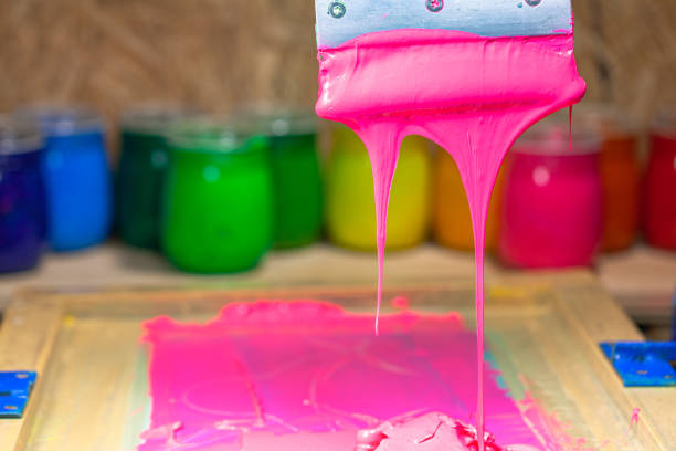istock pink color dripping from hand screen printing 1250795375