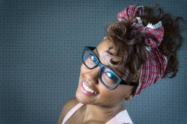Beautiful hipster woman smiling at camera - Studio shot