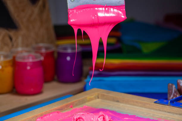 istock pink color dripping from hand screen printing 1250808039
