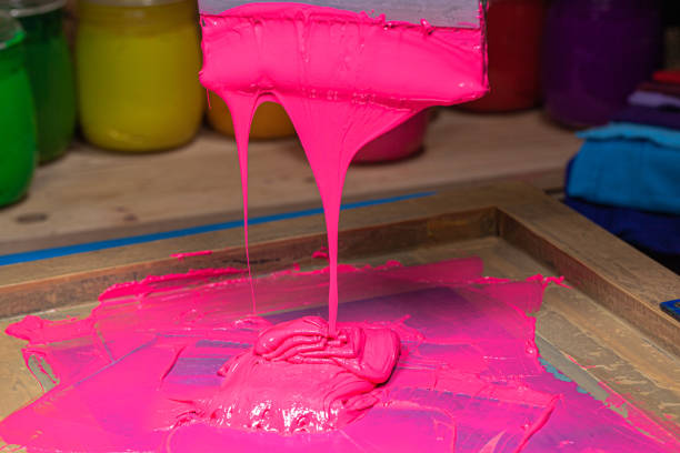 istock pink color dripping from hand screen printing 1250808045