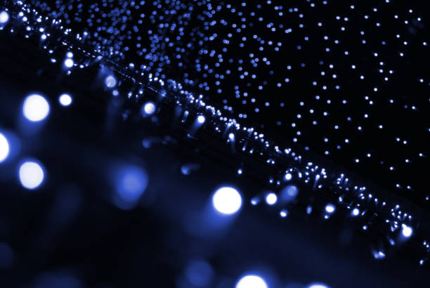 istock Light blue garland blurry lights at night 1250831208