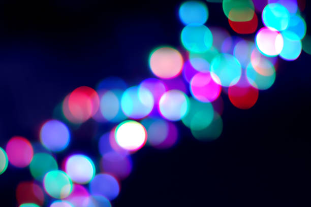 istock Blurry garland lights diagonal on dark for concept or new year holidays design 1250831209