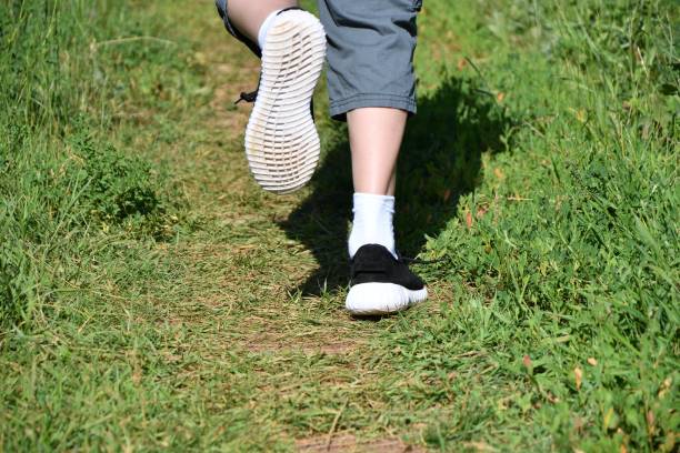 istock Legs runner boy in sneakers 1250836313