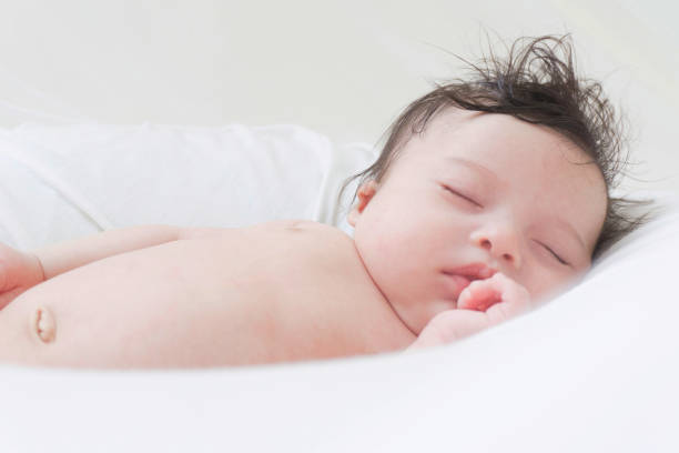 istock Beautiful baby sleeping safe at home 1250841411