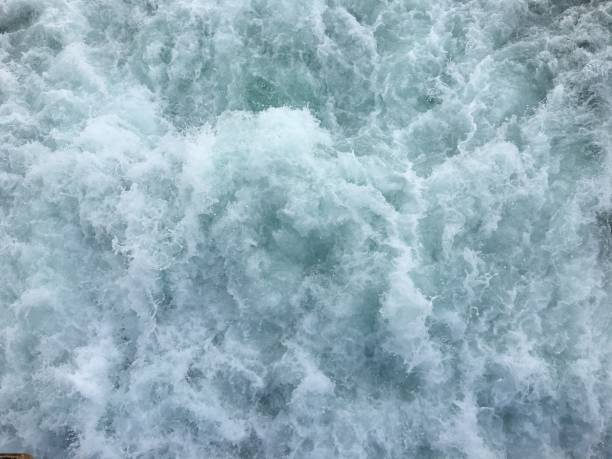 istock blue sea foam water background 1250842793