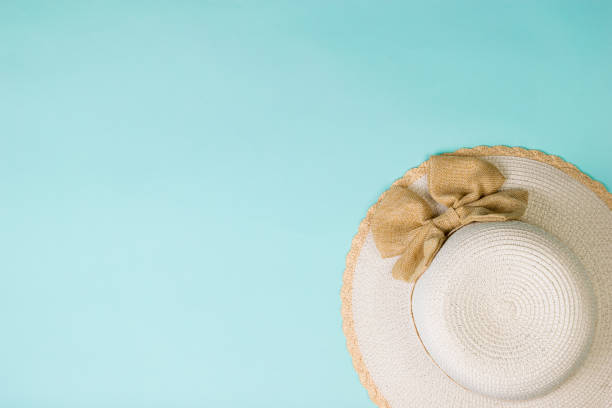 istock Women's sun hat on a light blue background. Flat lay. 1250853973