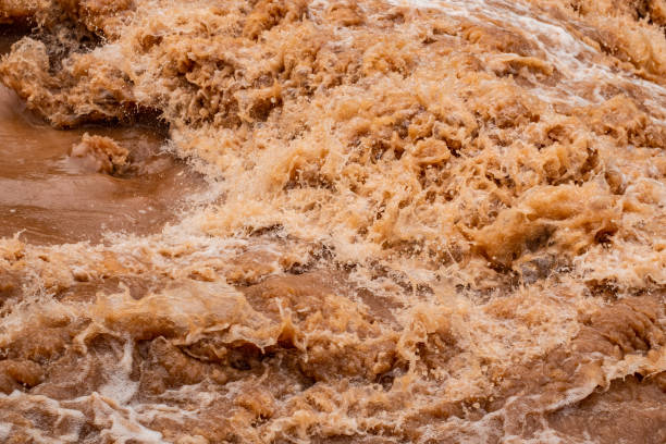istock Muddy flood splashing water slow-motion 1250908231