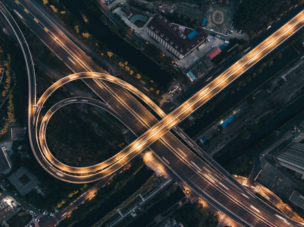 top view of overpass and city traffic at night - car highway speed traffic imagens e fotografias de stock