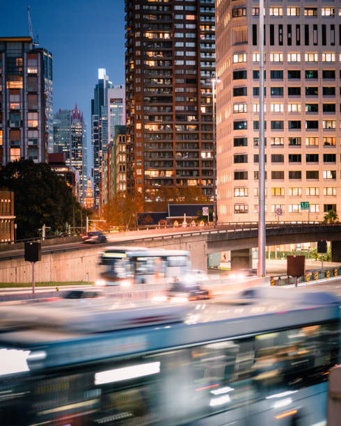istock Traffic flows by with city skyline in the background 1250909317