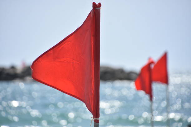 istock Red flag with the sea, Signal warning. 1250910233