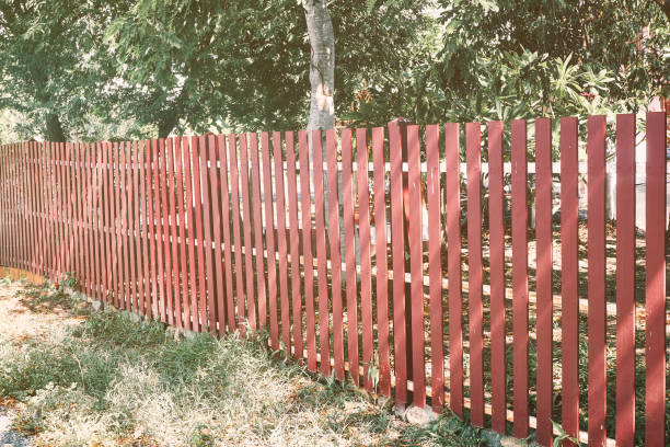 istock Red wooden fence at noon 1250911987
