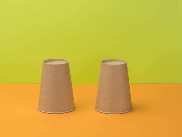 istock Disposable tableware for catering in orange and a bright green background. 1250915669