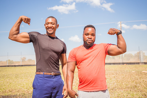Group Portrait of African / Zambian body builders showing mussles Stock Photo