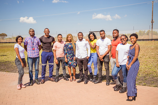 Group Portrait of African / Zambian Boys and Girls Smiling at the Camera Stock Photo