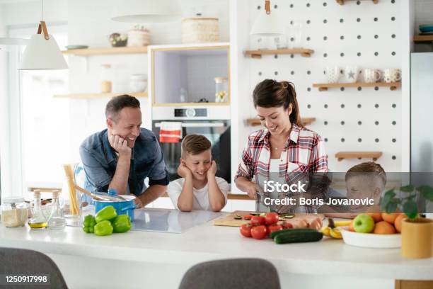 Young Happy Family Making Sandwich At Home Stock Photo - Download Image Now - Happiness, Kitchen, Family