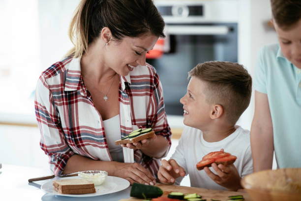 istock Young family preparing breakfast at home. 1250918739