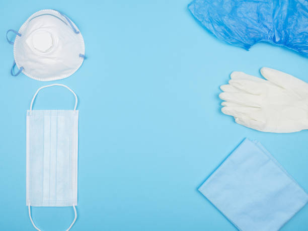istock Medical personal protective equipment on a blue background. 1250919014