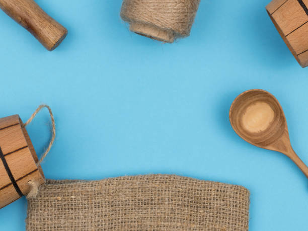 istock Everyday objects from wood and other natural materials on a blue background. 1250919862