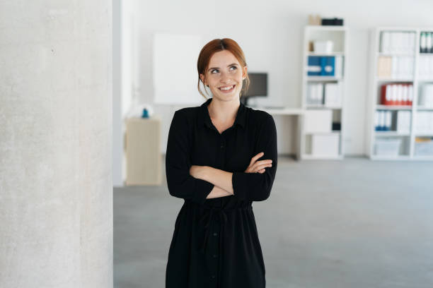 istock Young business manageress standing thinking 1250920068