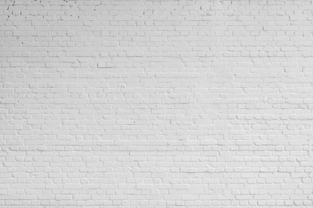 White brick wall. Designer interior background. Abstract architectural surface. wall stock pictures, royalty-free photos & images